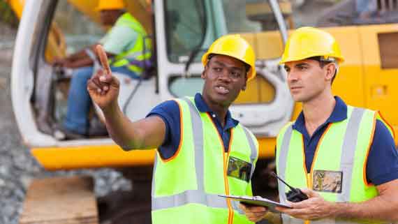 Effortless Personnel Tracking - Two construction workers discussing something