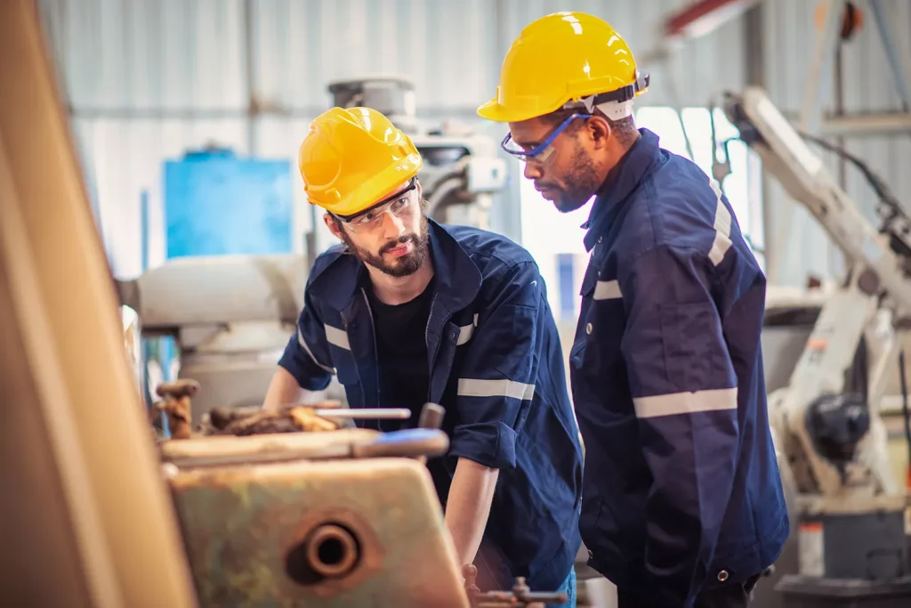 Employees working together in a factory setting
