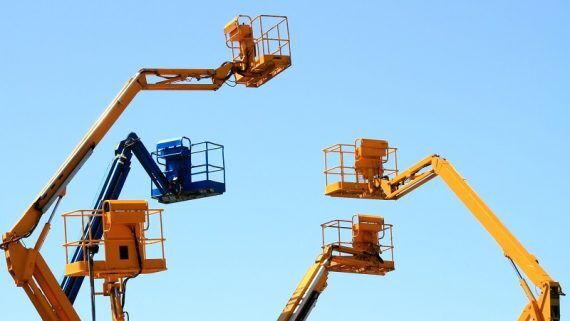 A fleet of Aerial Lifts standing in line - Aerial Work Platforms